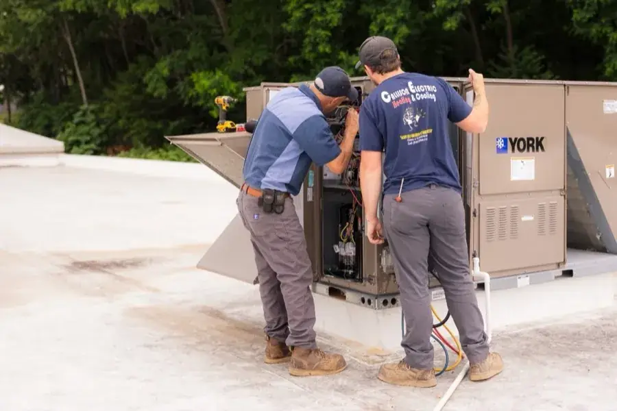 Callison HVAC technicians servicing a rooftop York unit during a maintenance call in Augusta County, Virginia
